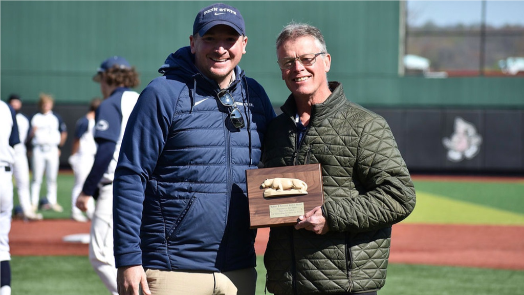 Penn State DuBois athletic director Ken Nellis (right) was awarded the Robert J. Scannell Roll of Honor by PSUAC Commissioner Ryan Ehrie in May for his many contributions to the conference over his 16 years with the University.